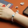 A single-loop bracelet made of white jade and Hetian jade, 999 gold coins, turquoise, meander beads, hanging dry green, and peace pendant for women details Picture